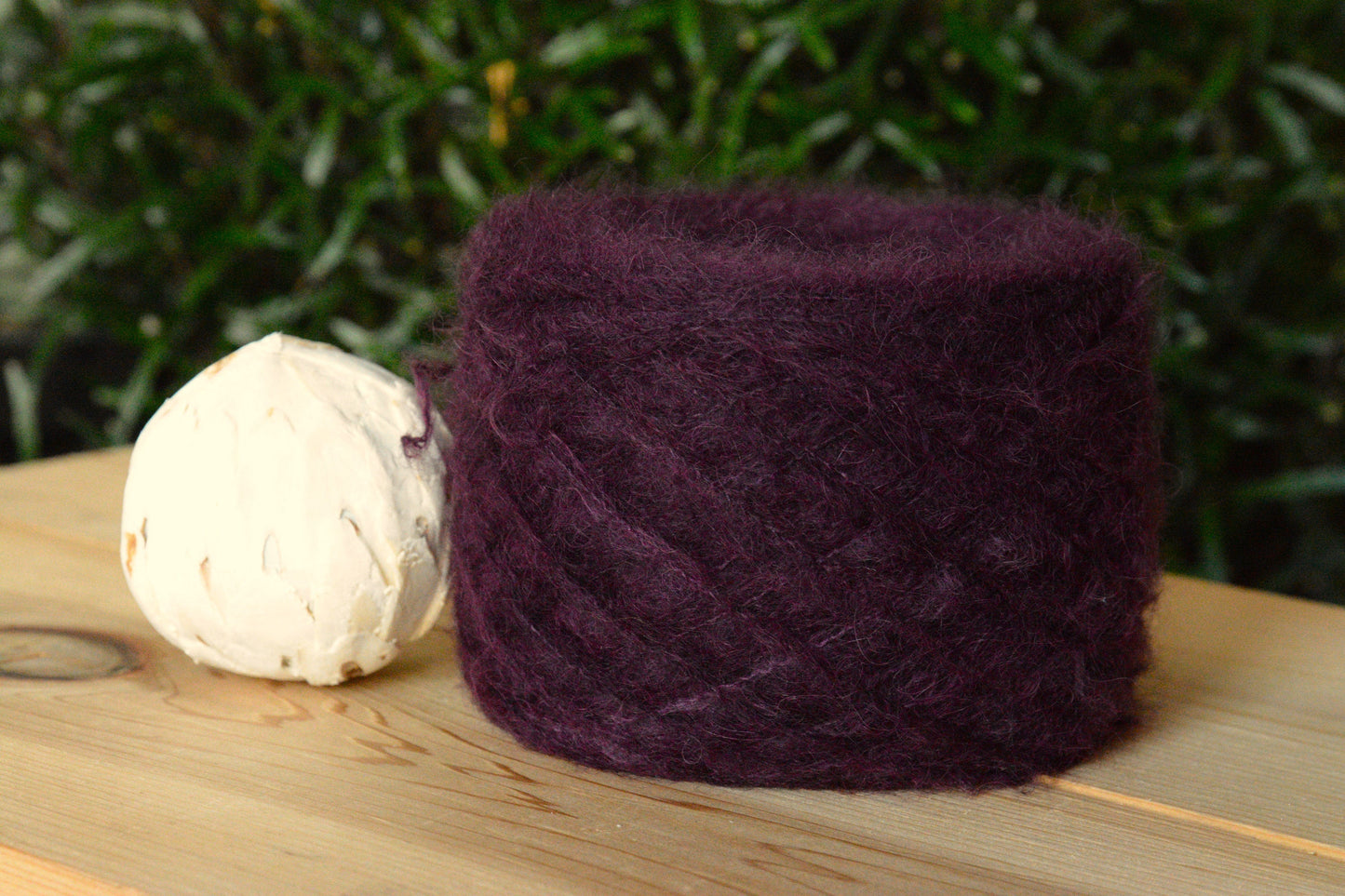 Mulberry - brushed lace weight 74 per cent baby suri alpaca 26 per cent silk, 50g 328 yards. Silk core. Soft, extra fluffy. Deep wine red.