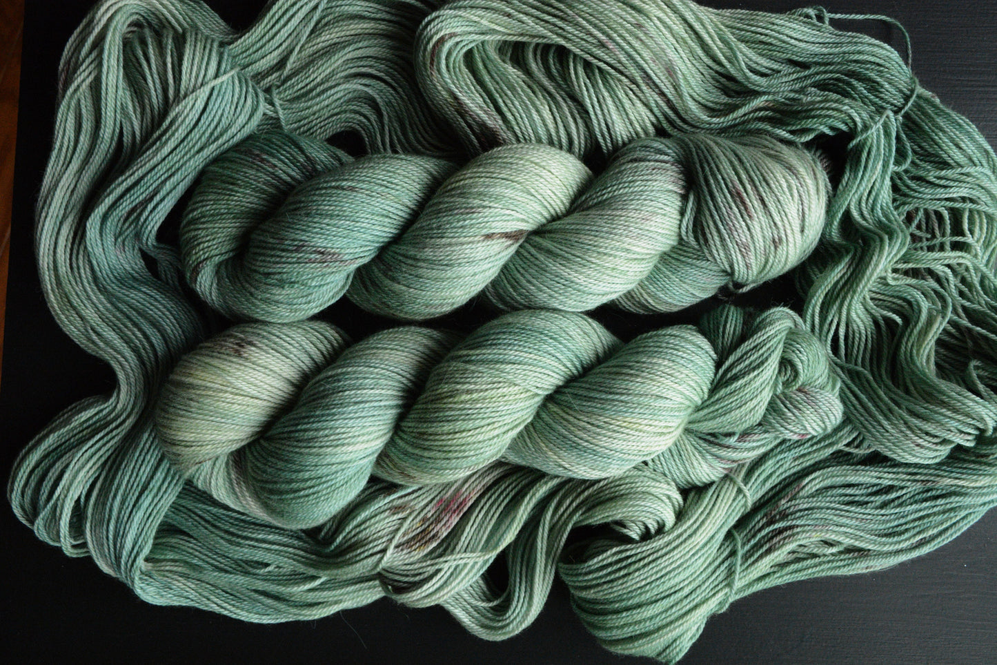 Clarity - alpaca merino blend, sport weight yarn, non-super wash, 100g 328 yds, sage green with brown speckles, super soft.