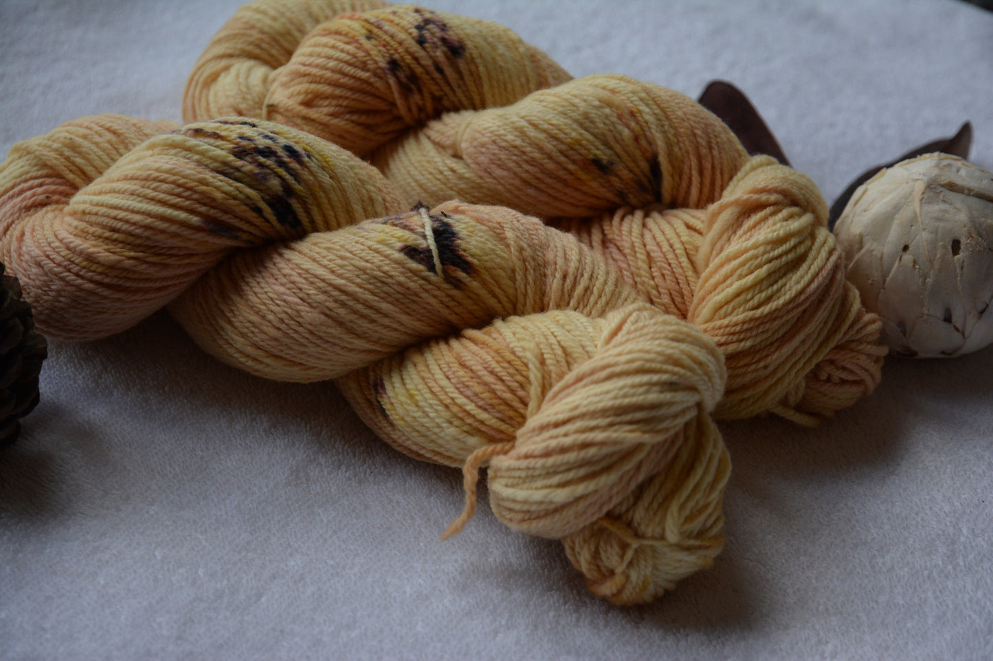 Champagne Sunrise - warm yellow peach tones 3-ply hand-dyed DK 100% non-super wash merino. Soft 17.8 micron 99.9 percent comfort factor