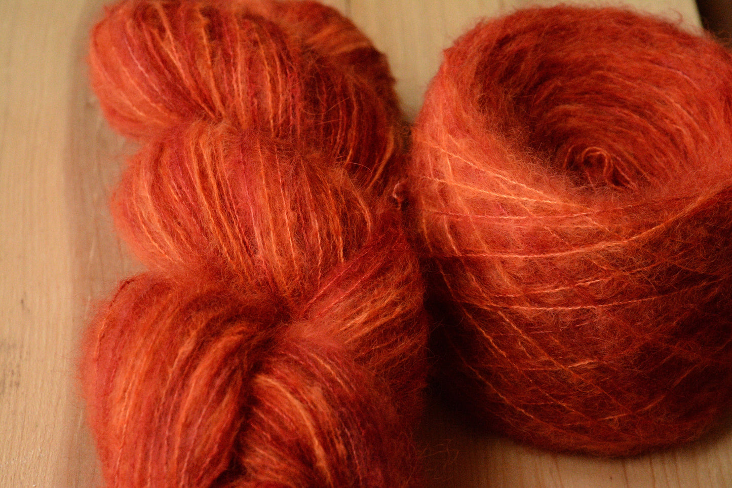 Blood Orange - brushed lace weight 74 per cent baby suri alpaca 26 per cent silk, 50g 328 yards, orange red. Silk core. Soft, extra fluffy.