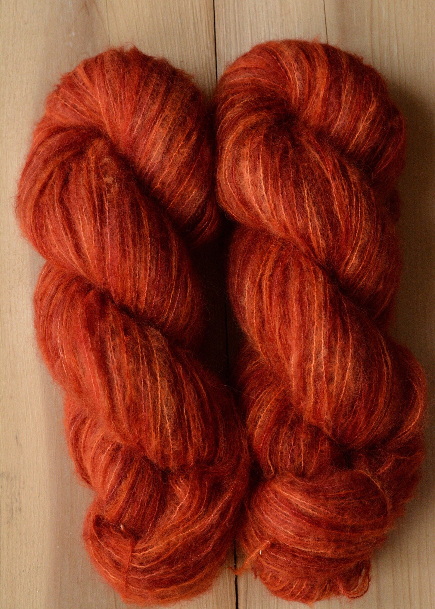 Blood Orange - brushed lace weight 74 per cent baby suri alpaca 26 per cent silk, 50g 328 yards, orange red. Silk core. Soft, extra fluffy.