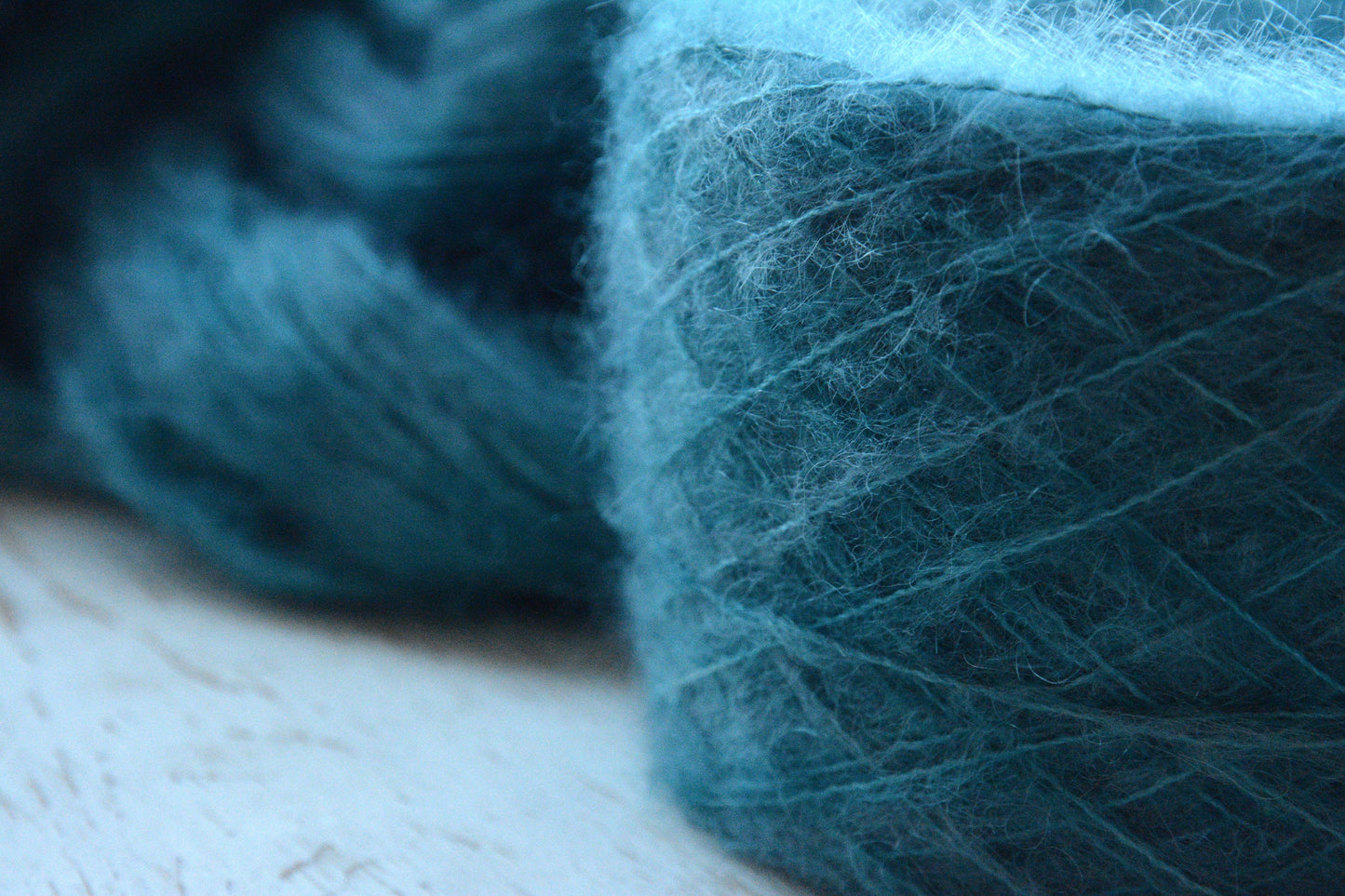 Siren - brushed lace weight 74 per cent baby suri alpaca 26 per cent silk, 50g 328 yards. Silk core. Soft extra fluffy. Aqua, turquoise.