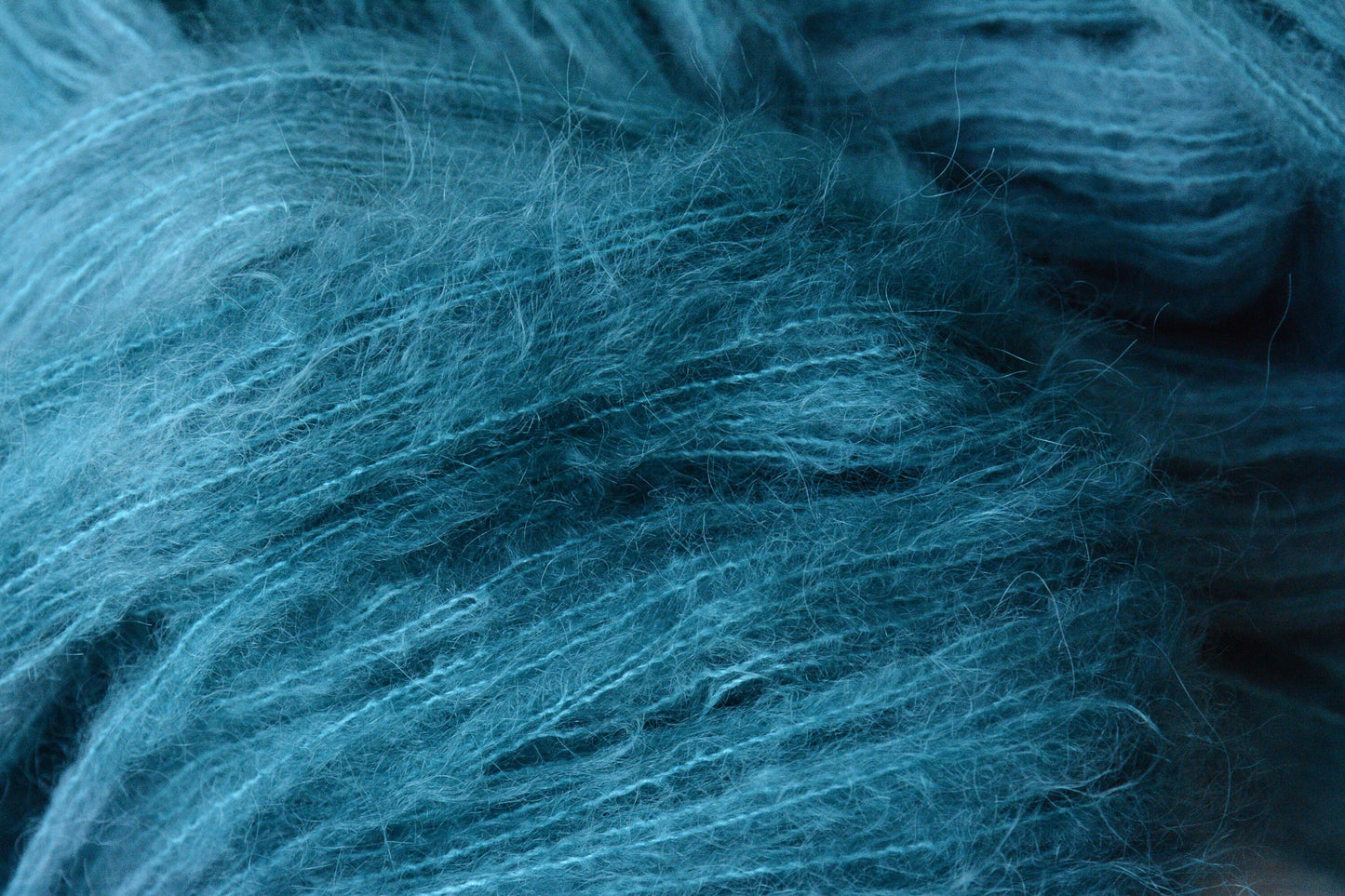 Siren - brushed lace weight 74 per cent baby suri alpaca 26 per cent silk, 50g 328 yards. Silk core. Soft extra fluffy. Aqua, turquoise.