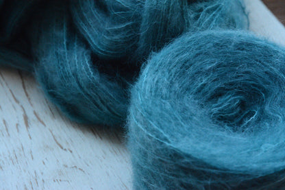 Siren - brushed lace weight 74 per cent baby suri alpaca 26 per cent silk, 50g 328 yards. Silk core. Soft extra fluffy. Aqua, turquoise.