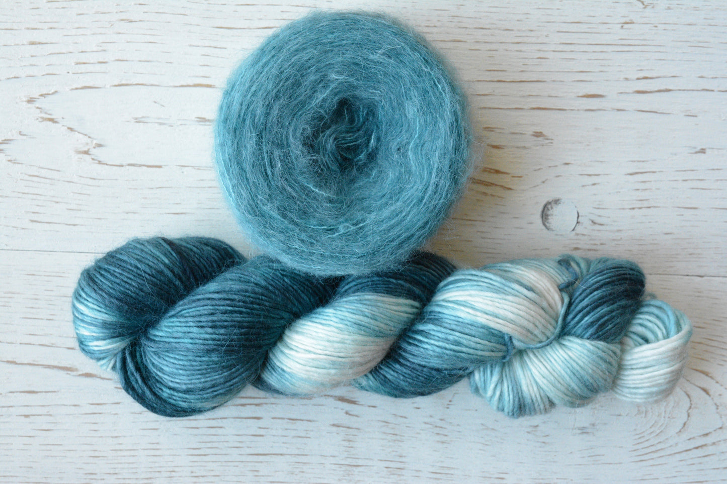 Siren - brushed lace weight 74 per cent baby suri alpaca 26 per cent silk, 50g 328 yards. Silk core. Soft extra fluffy. Aqua, turquoise.