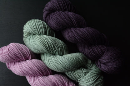 Damson - 4-ply 100% non-super wash worsted weight merino yarn. 100g, 218 yards, deep plum purple. Soft 20.5 micron. Semi-solid.