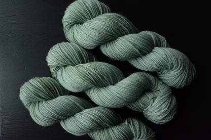 Sage Wisdom - 4-ply 100% non-super wash worsted weight merino yarn. 100g, 218 yards, mid sage green. Soft 20.5 micron. Semi-solid.