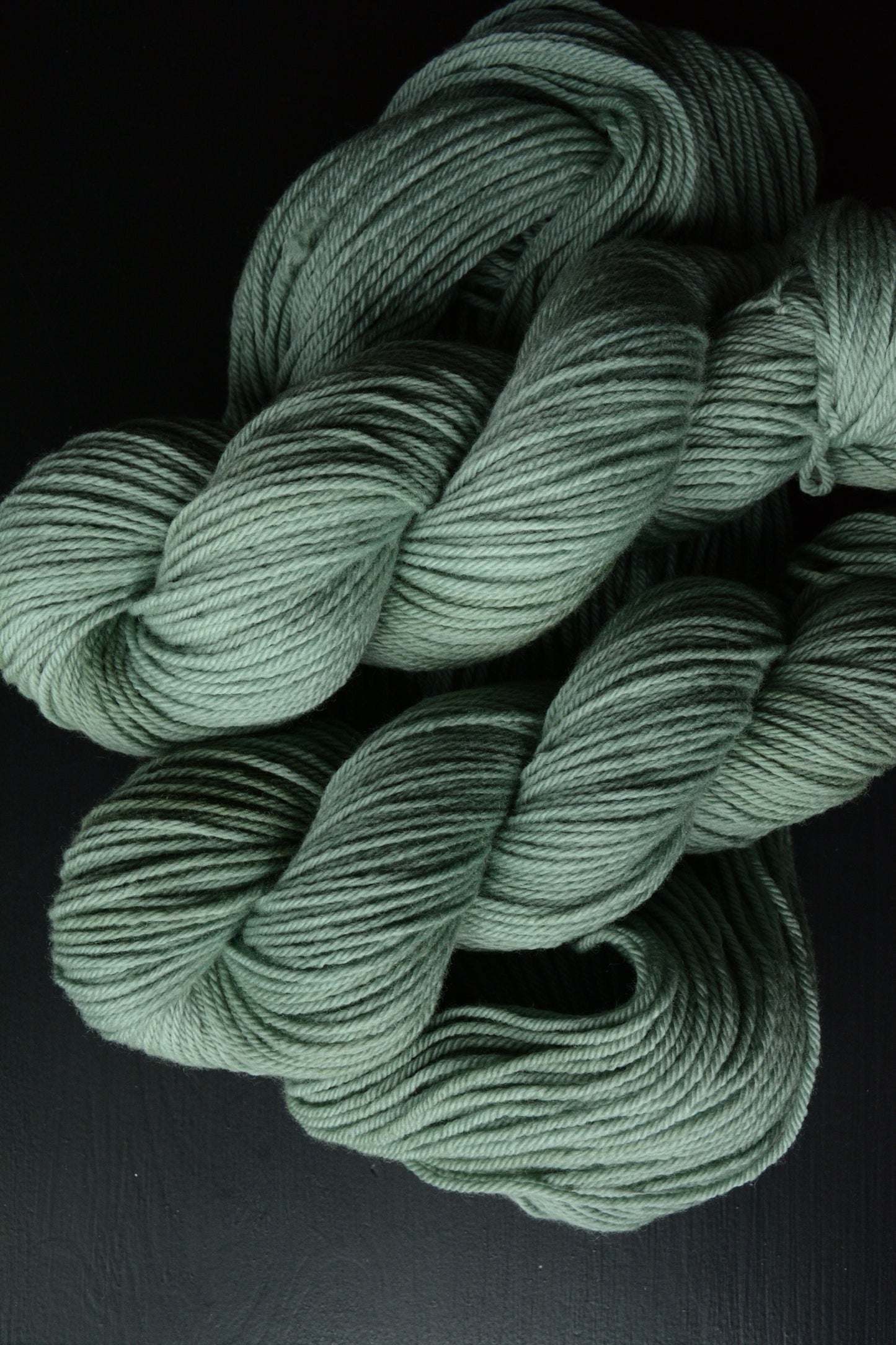 Sage Wisdom - 4-ply 100% non-super wash worsted weight merino yarn. 100g, 218 yards, mid sage green. Soft 20.5 micron. Semi-solid.