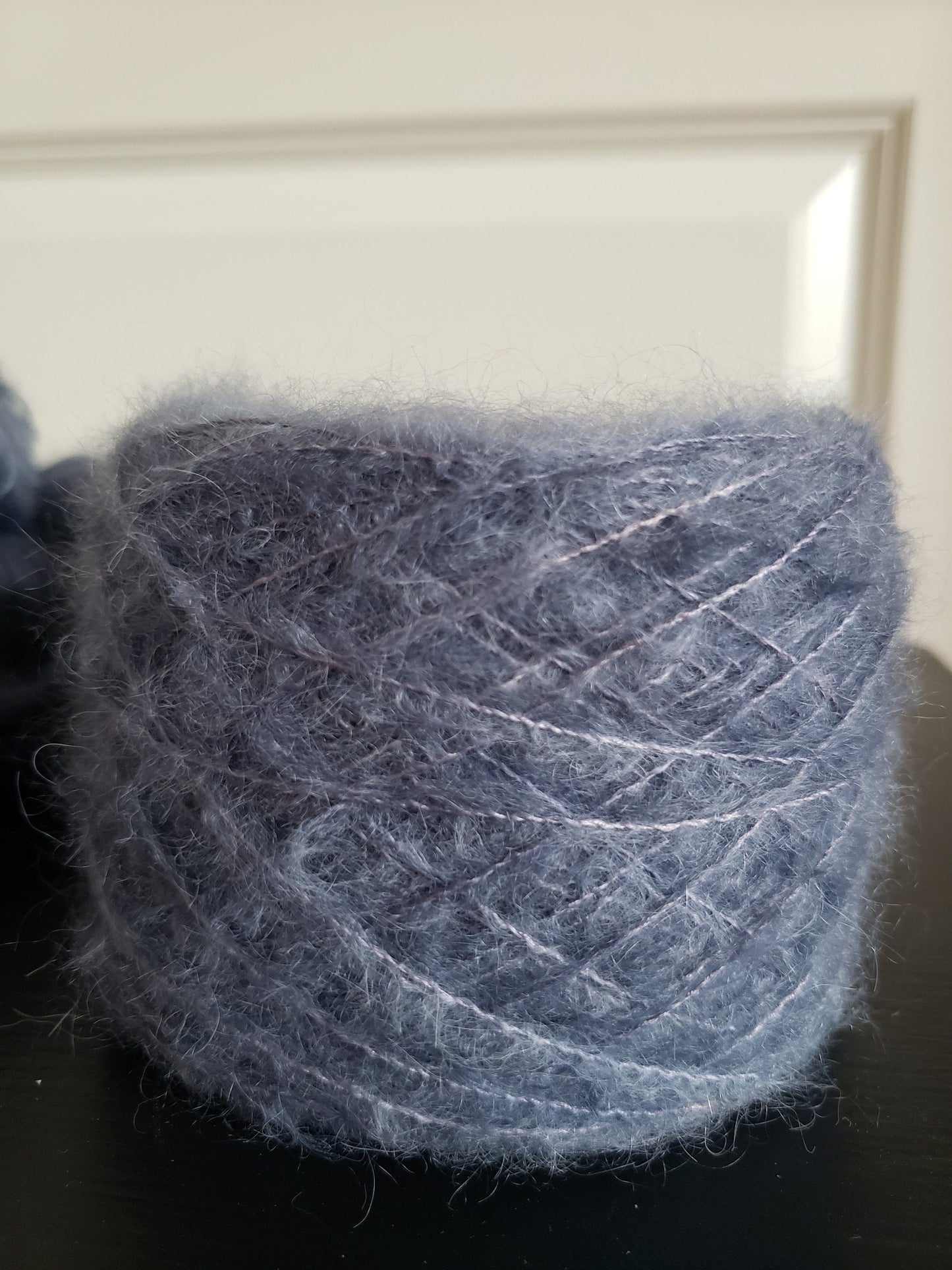 Birds of a Feather - brushed lace weight 74 per cent baby suri alpaca 26 per cent silk 50g 328 yards, silk core. Soft blue gray.