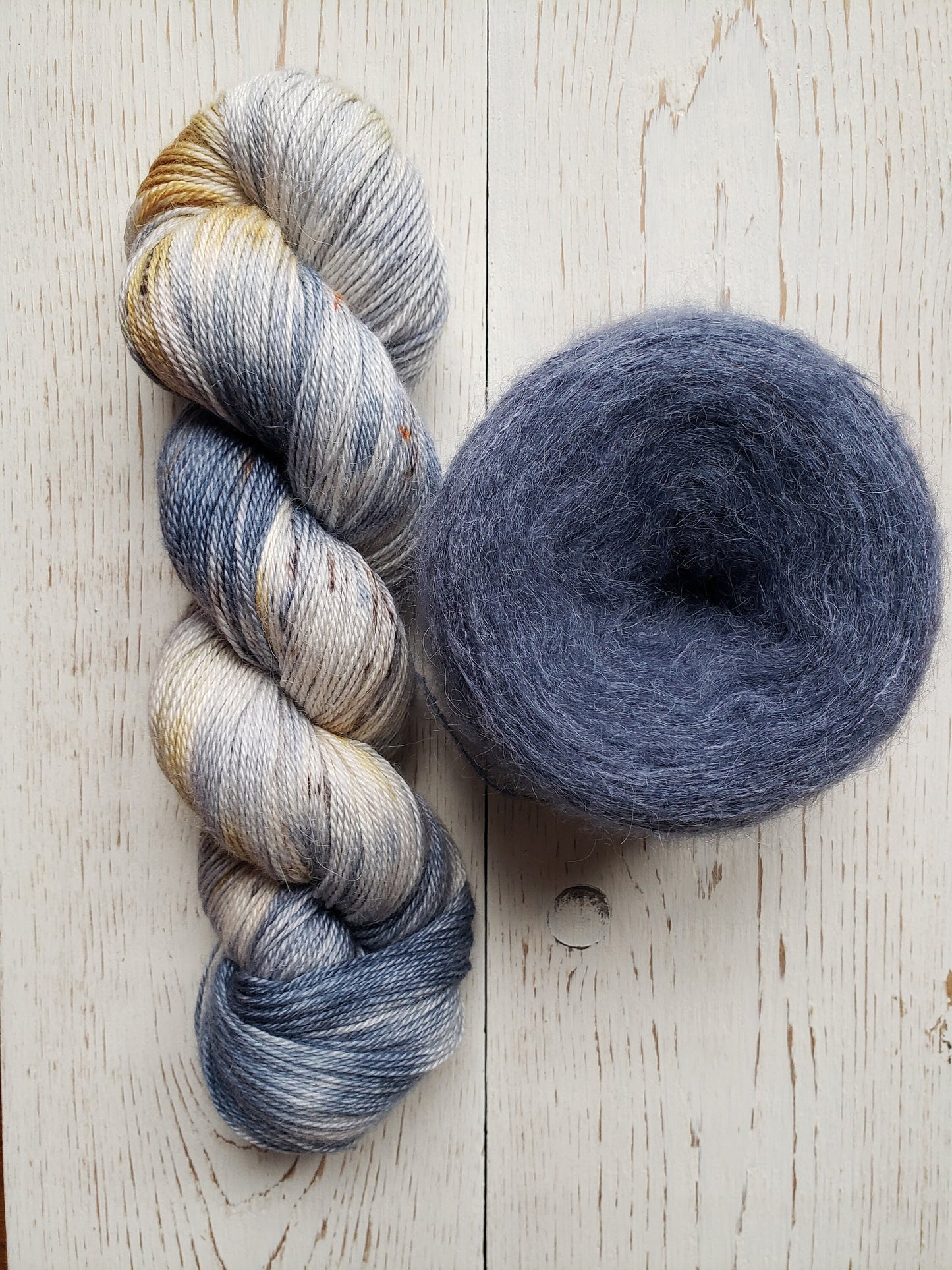 Birds of a Feather - brushed lace weight 74 per cent baby suri alpaca 26 per cent silk 50g 328 yards, silk core. Soft blue gray.