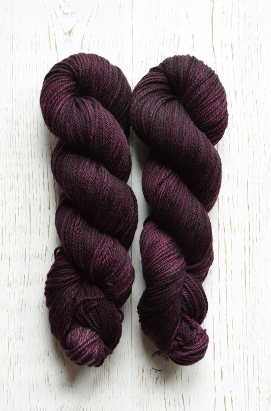 Mulberry - 4-ply 100% non-super wash worsted weight merino yarn. 100g, 218 yards, deep reddish purple. Soft 20.5 micron. Semi-solid.