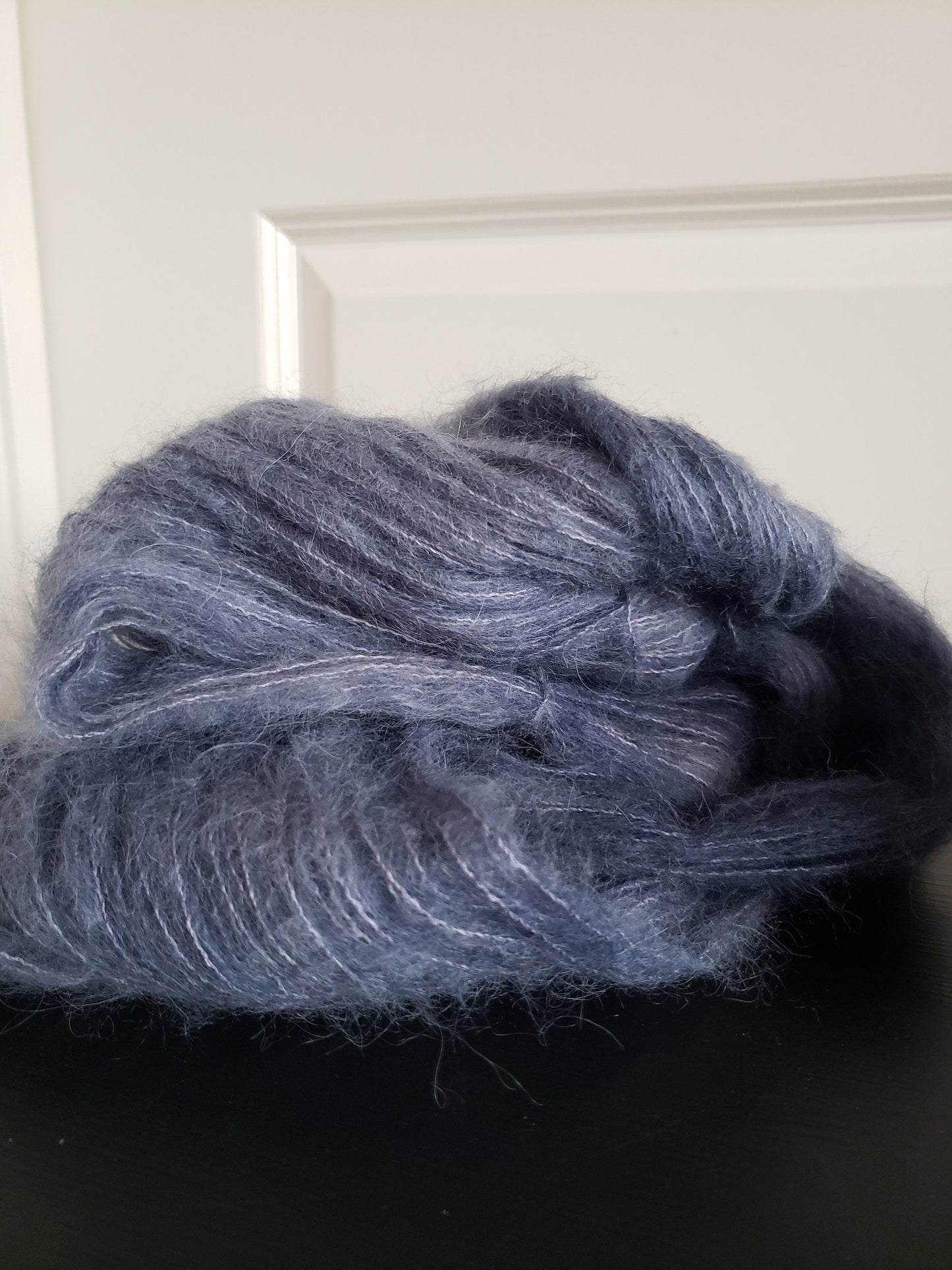 Birds of a Feather - brushed lace weight 74 per cent baby suri alpaca 26 per cent silk 50g 328 yards, silk core. Soft blue gray.