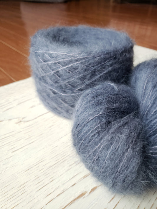 Birds of a Feather - brushed lace weight 74 per cent baby suri alpaca 26 per cent silk 50g 328 yards, silk core. Soft blue gray.