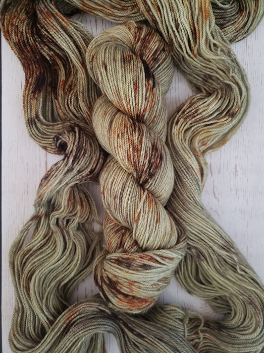 Lichen - alpaca merino blend, sport weight yarn, non-super wash, 100g 328 yds, green with orange and brown speckles.