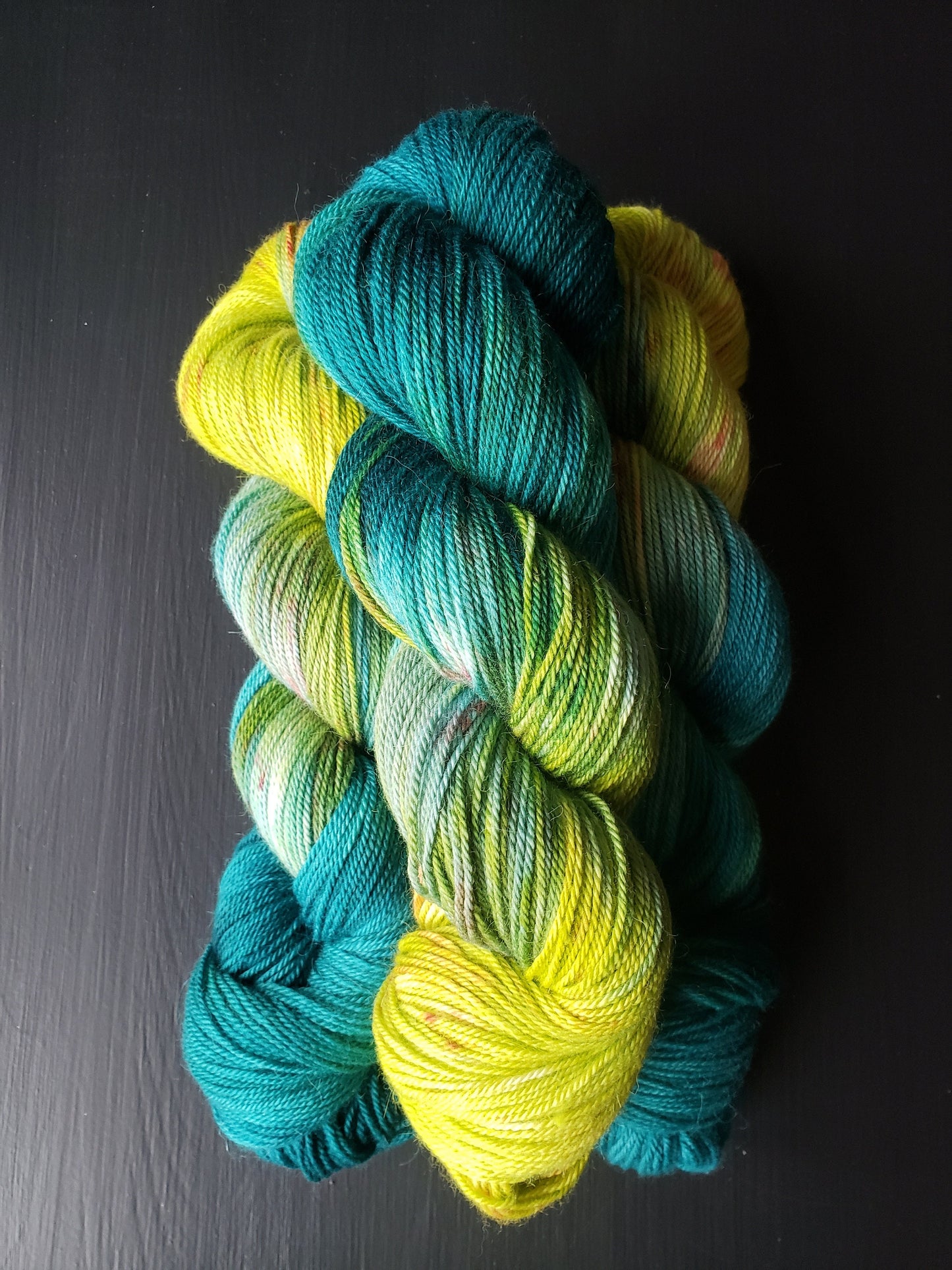 Serendipity - alpaca merino blend, sport weight yarn, non-super wash, 100g 328 yds, teal green chartreuse with orange speckles, super soft.