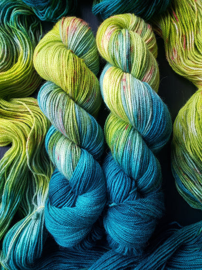 Serendipity - alpaca merino blend, sport weight yarn, non-super wash, 100g 328 yds, teal green chartreuse with orange speckles, super soft.