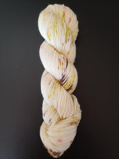 Tuesday's Child - DK single ply,  alpaca/merino/silk blend, 100g 252 yds, chartreuse brown peach orange speckles on white