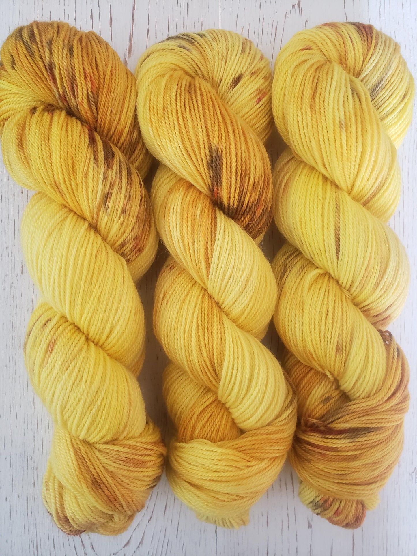 Sunflower - alpaca merino blend, sport weight yarn, non-super wash, 100g 328 yds, sunny yellow with brown and orange speckles, super soft.