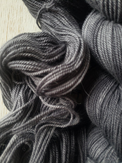 Shadows - alpaca merino blend 3 ply non-super wash sport weight yarn. 100g, 328 yards, tonal charcoal gray.