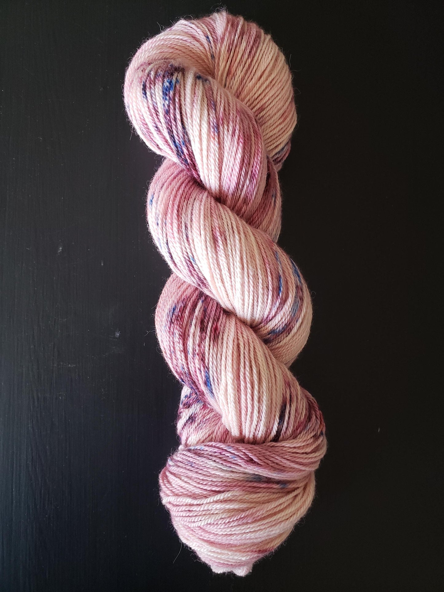 Anemone - alpaca merino blend 3 ply non-super wash sport weight yarn. 100g, 328 yards, pinks with blue pink mauve speckles.