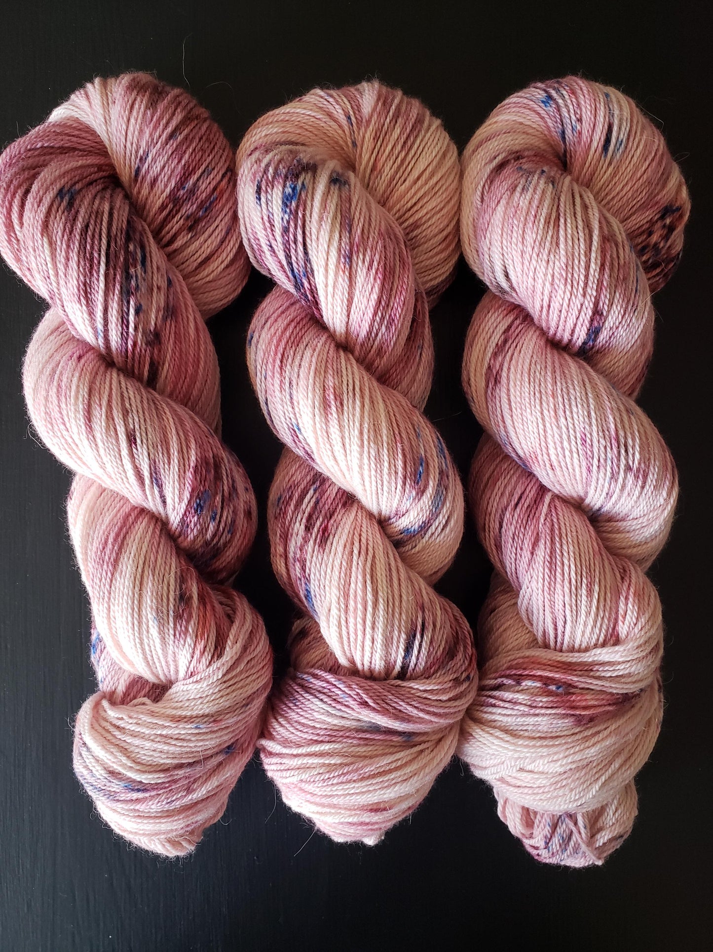 Anemone - alpaca merino blend 3 ply non-super wash sport weight yarn. 100g, 328 yards, pinks with blue pink mauve speckles.