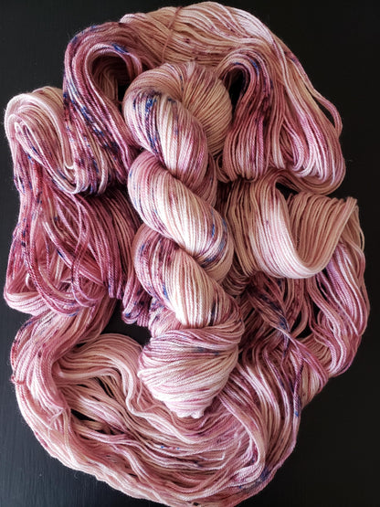 Anemone - alpaca merino blend 3 ply non-super wash sport weight yarn. 100g, 328 yards, pinks with blue pink mauve speckles.