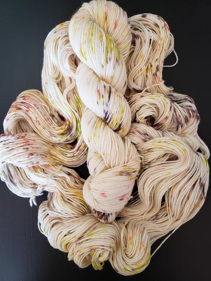 Tuesday's Child - DK single ply,  alpaca/merino/silk blend, 100g 252 yds, chartreuse brown peach orange speckles on white