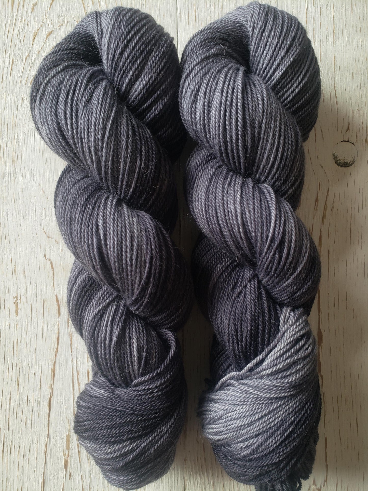 Shadows - alpaca merino blend 3 ply non-super wash sport weight yarn. 100g, 328 yards, tonal charcoal gray.