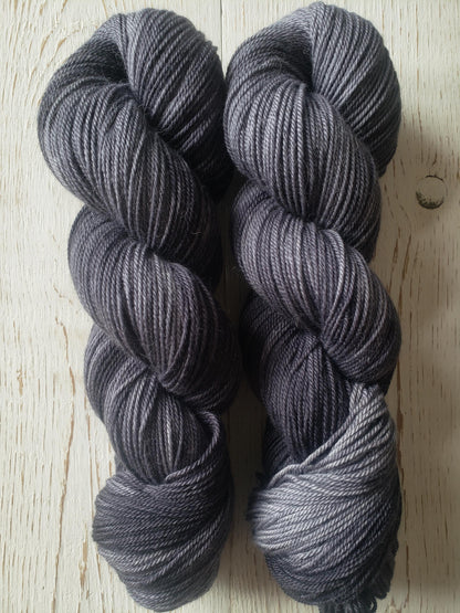 Shadows - alpaca merino blend 3 ply non-super wash sport weight yarn. 100g, 328 yards, tonal charcoal gray.