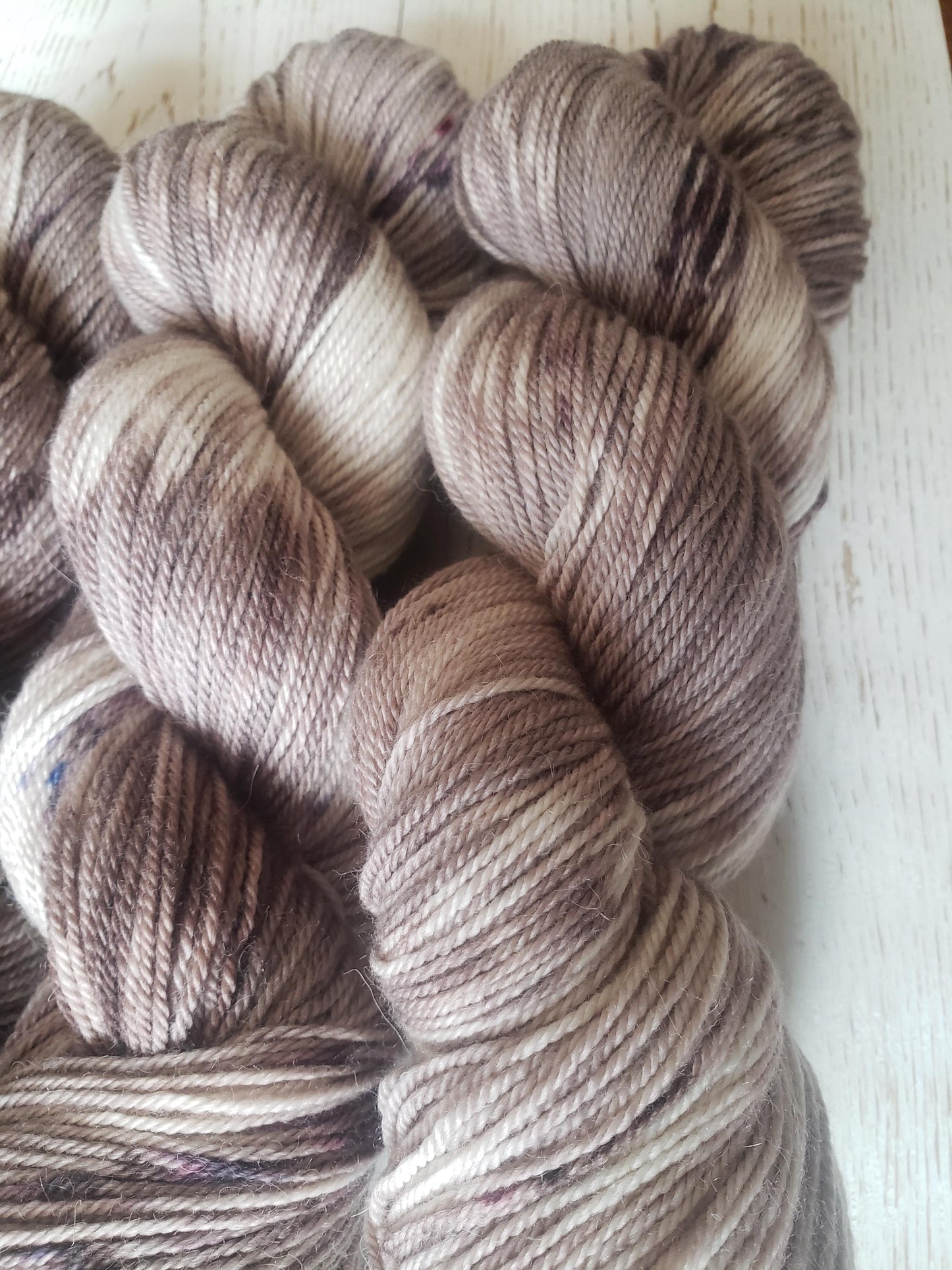 Sparrow - alpaca merino blend, sport weight yarn, non-super wash, 100g 328 yds, warm gray brown with brown speckles.