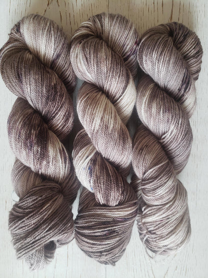 Sparrow - alpaca merino blend, sport weight yarn, non-super wash, 100g 328 yds, warm gray brown with brown speckles.