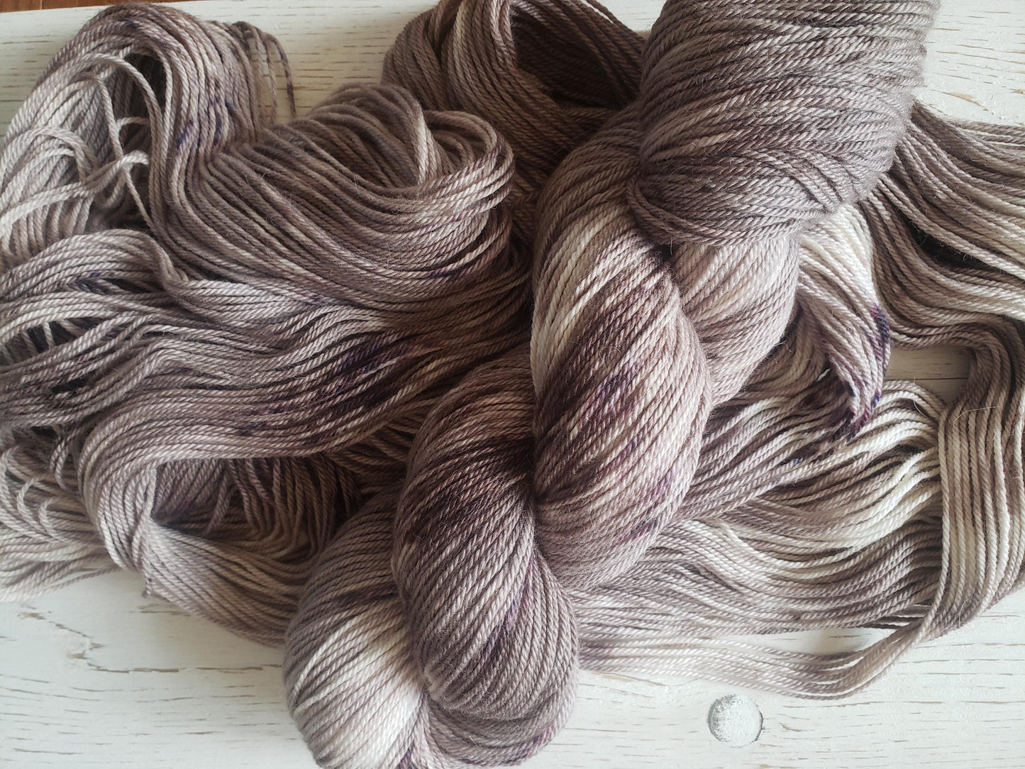 Sparrow - alpaca merino blend, sport weight yarn, non-super wash, 100g 328 yds, warm gray brown with brown speckles.