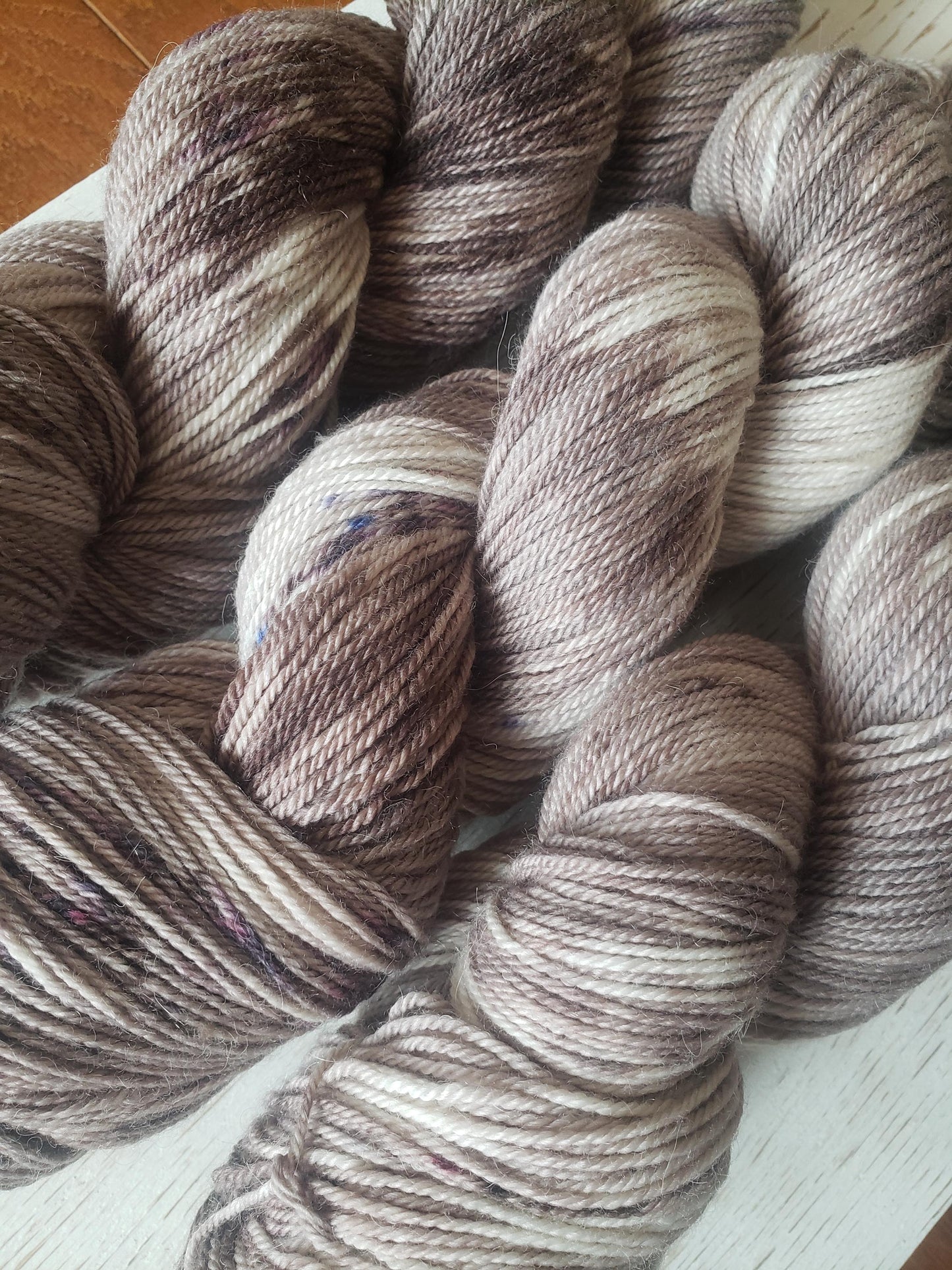 Sparrow - alpaca merino blend, sport weight yarn, non-super wash, 100g 328 yds, warm gray brown with brown speckles.