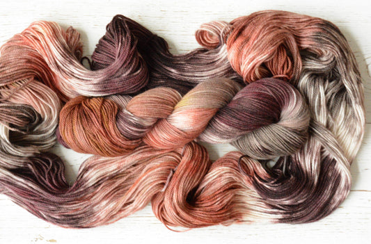 Peach Stone - alpaca merino blend on soft sport weight yarn, non-super wash, 100g 328 yds, warm peach pink, tan gold, gray brown variegated.