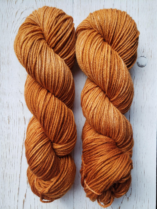 Acorn - 4-ply 100% non-super wash worsted weight merino yarn. 100g, 218 yards, caramel toffee tan gold brown. Soft 20.5 micron.